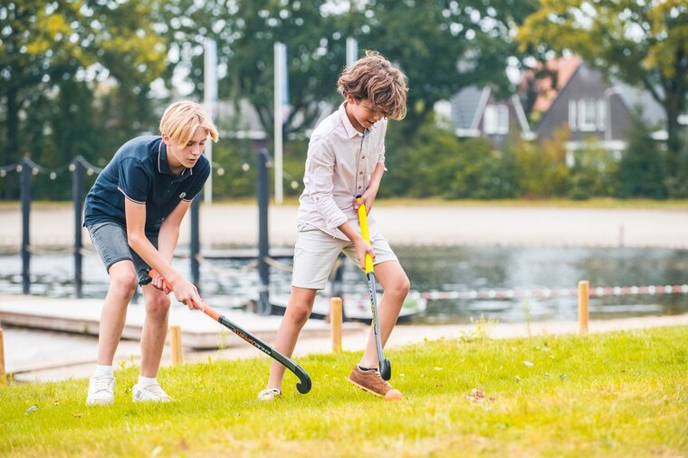 Hockeyset 2 kunststof sticks (oranje en groen) 30 inch met oranje bal in tas | Angel Sports